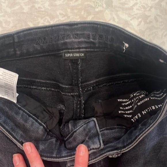 American Eagle Black jeans ripped only on bottom trim - Picture 2 of 2